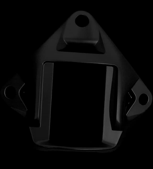 Close-up of a black NVG shroud mount for helmets, featuring three screw holes and a rectangular central slot for NVG attachment.