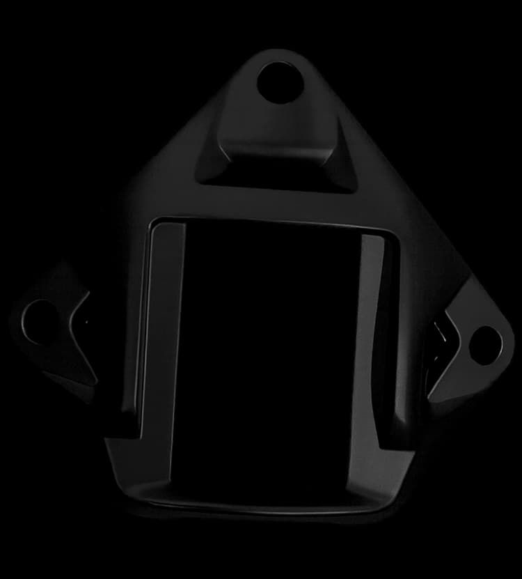 Close-up of a black NVG shroud mount for helmets, featuring three screw holes and a rectangular central slot for NVG attachment.
