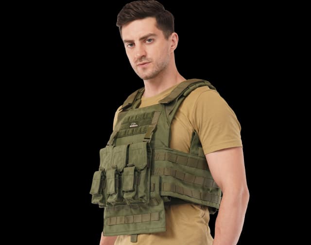Man wearing Hard Shell Plate Carrier Vest - Slick I in olive green, showcasing modular front pouches and fit.