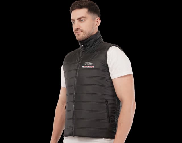 Hard Shell black winter turf vest for men, lightweight sleeveless jacket with front zipper and logo branding for cold weather.