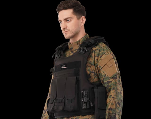Man wearing Hard Shell Rhino Tactical Vest in black, designed for military and law enforcement protection.