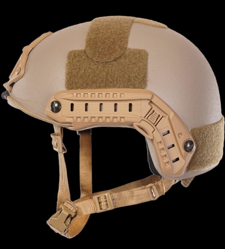 Angled side view of tan Special Force tactical helmet with NVG mount, side rails, and padded chin strap.