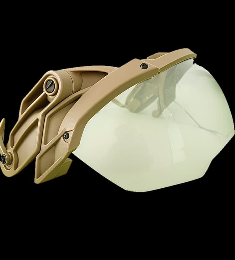 Angled view of a tan fragment visor with a curved lens and foldable mounting arms.