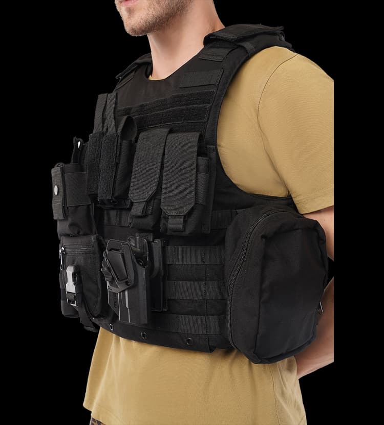 Model wearing the Hard Shell Tactical Carrier – MRAP vest with side utility pouches, holster, and front modular storage.