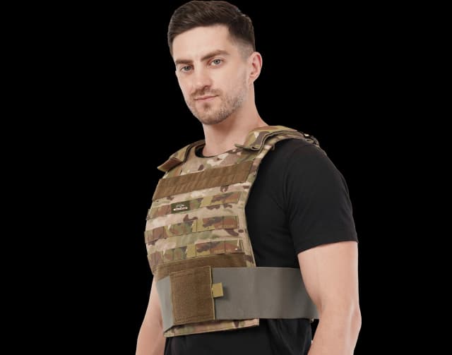 Man wearing Hard Shell Phantom Vest in multicam pattern, showing side view and adjustable waist strap.