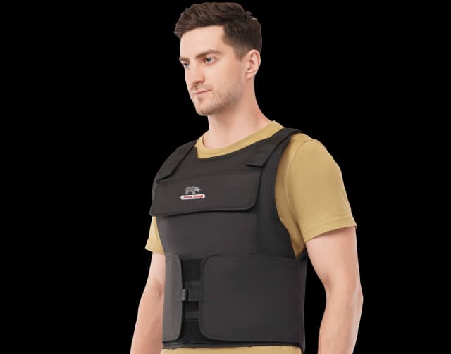 Man wearing Hard Shell black multi-purpose vest over tan t-shirt, showcasing front and side view of lightweight tactical body armor.