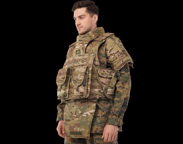 Model wearing Hard Shell camouflage Warrior Vest with utility pouches, neck, shoulder, and groin protection for advanced battlefield performance.