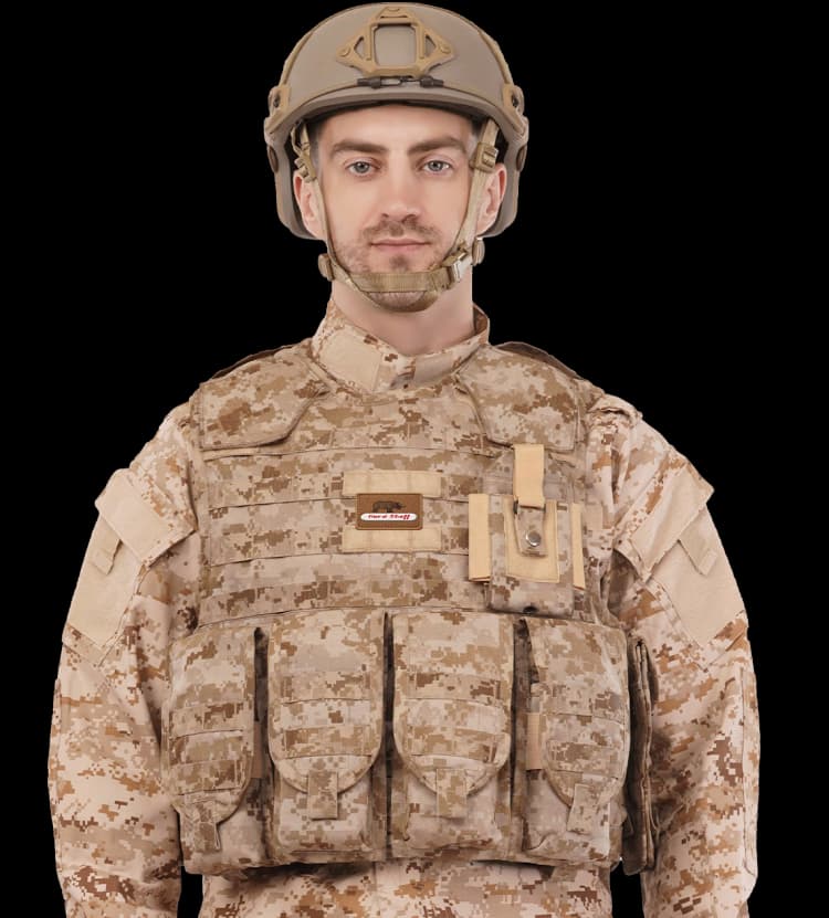 Soldier wearing Hard Shell PullTac Quick Release Vest in desert camo with front protection and storage.
