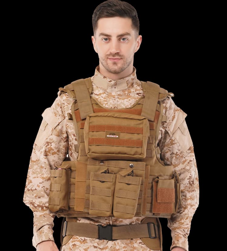 Man wearing Hard Shell Tactical Operator Vest AWRS in desert tan, showcasing front protection and storage pouches.