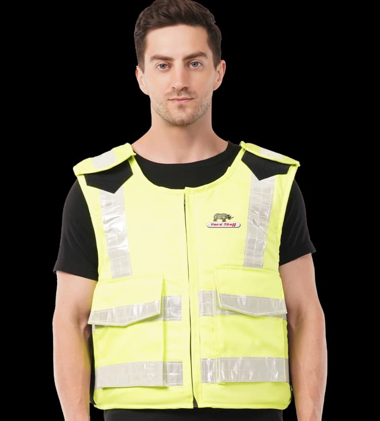 Model wearing a Hi-Viz safety jacket with reflective strips and Hard Shell logo, ideal for visibility and safety gear.