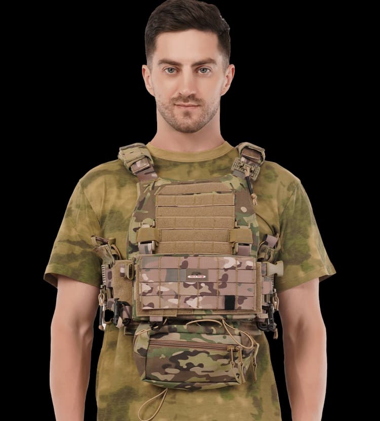 Man wearing Hard Shell Ranger Vest in camouflage, front view displaying tactical pouches and rugged build.