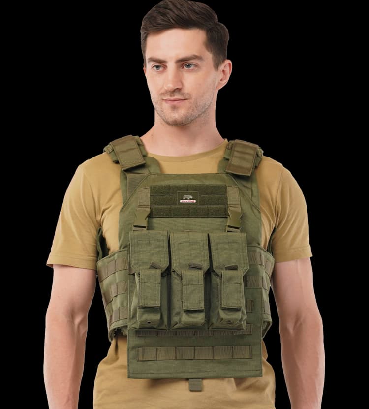 Man wearing Hard Shell Plate Carrier Vest - Slick I, displaying front tactical pouches and ergonomic design.