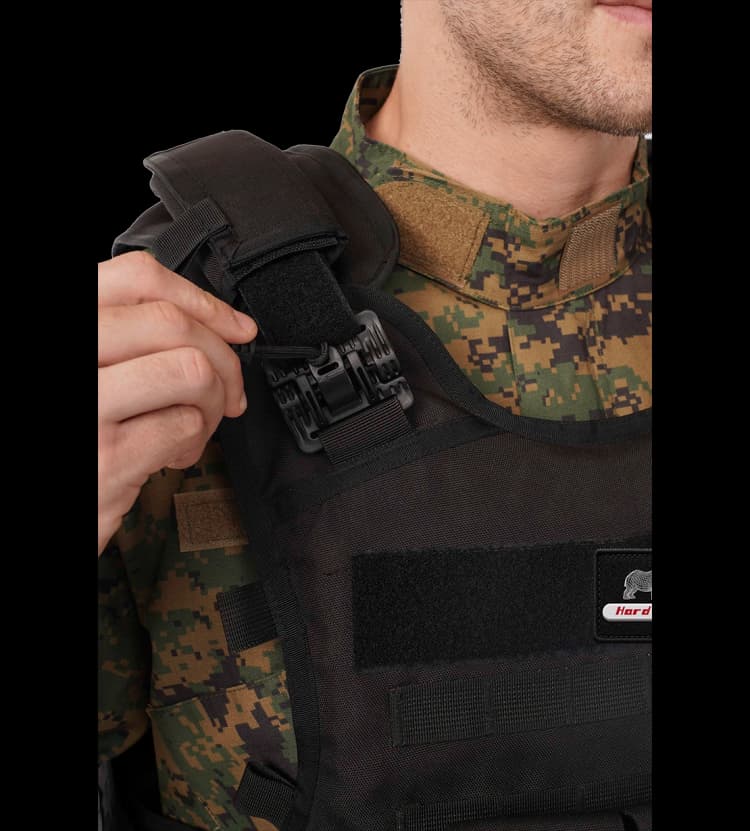 Close-up of Hard Shell Rhino Tactical Vest showing adjustable shoulder buckle for quick-release and secure fit.