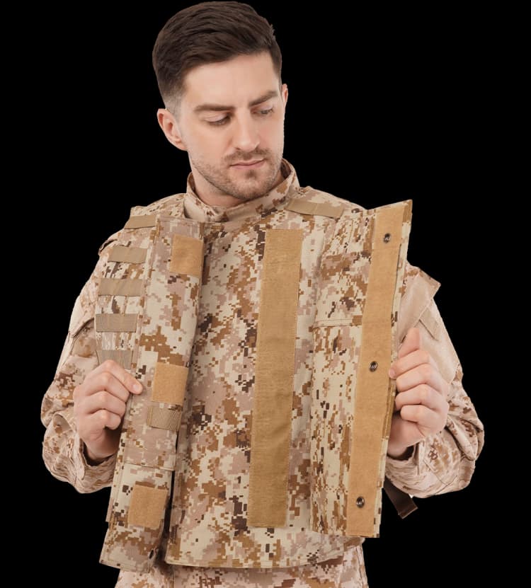 Model wearing Hard Shell desert digital camouflage Front Opening MOLLE Protector Vest, showing its secure front Velcro and snap closure system.