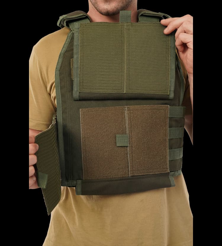 Close-up of Hard Shell Plate Carrier Vest - Slick II showing adjustable front flap and inner protection panels.
