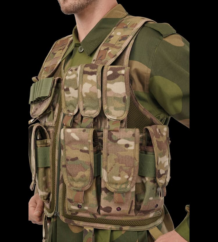 Close-up of Hard Shell Assault Vest showcasing organized utility pouches and durable front zipper closure.q