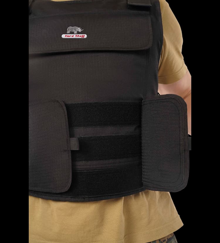 Close-up of Hard Shell black multi-purpose vest showing adjustable waist straps and front protective panel.