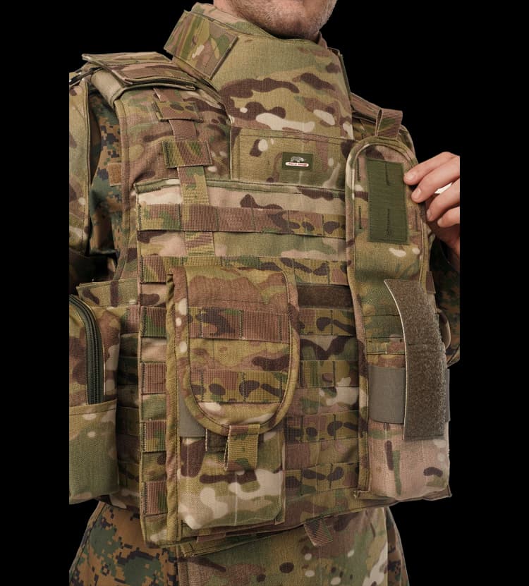 Close-up of Hard Shell camouflage Warrior Vest showing front utility pouches and adjustable shoulder flap for enhanced tactical functionality.