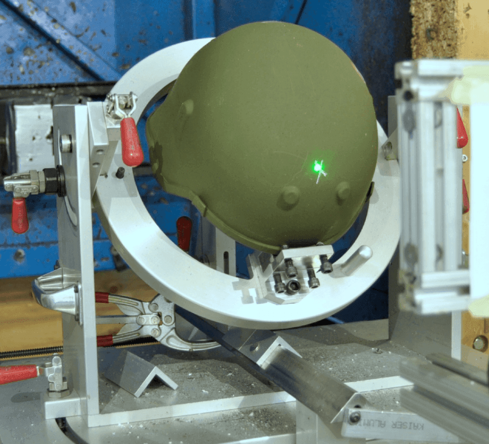 Hard Shell helmet mounted in a V50 ballistic test rig