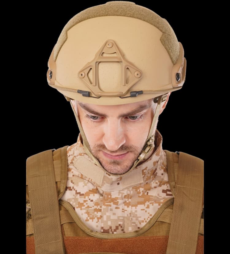 Soldier wearing tan RAPS Helmet and camouflage uniform front view tactical ballistic helmet