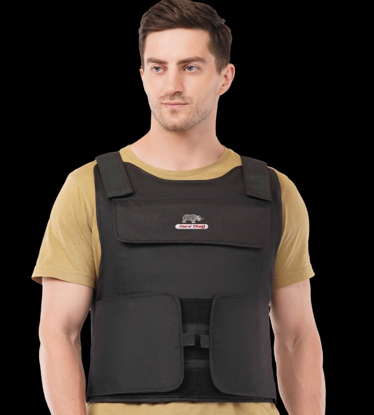 Man wearing Hard Shell black multi-purpose vest, showcasing front fit and protective coverage.