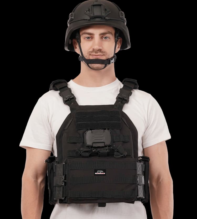 Man wearing Hard Shell TacSnap Plate Carrier, front view showing heavy-duty MOLLE panels and secure fit.