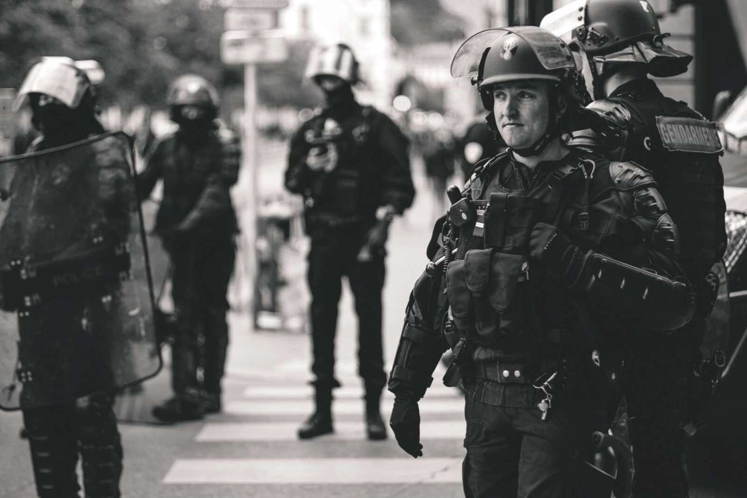 The Complete Solution for Personal Protection Military soldiers Standing to control riots Wearing all military gears and riot shield in hand