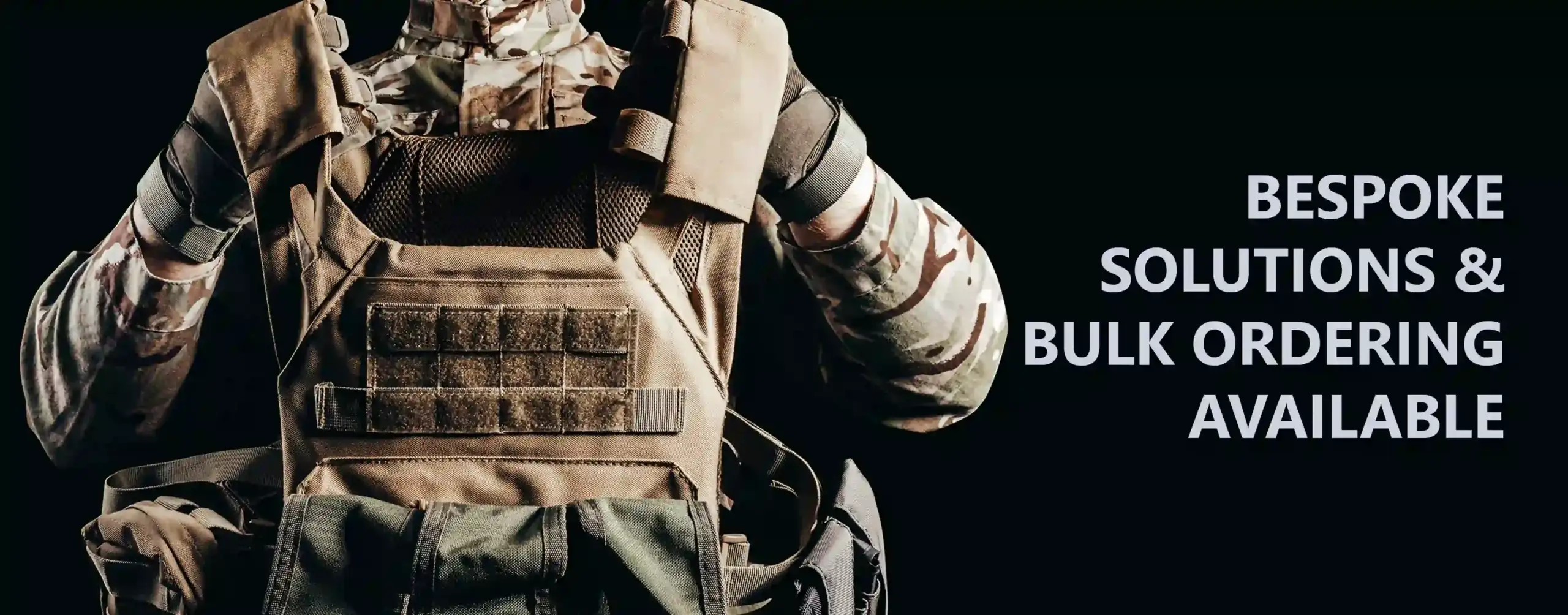 military soldier holding a bulletproof vest